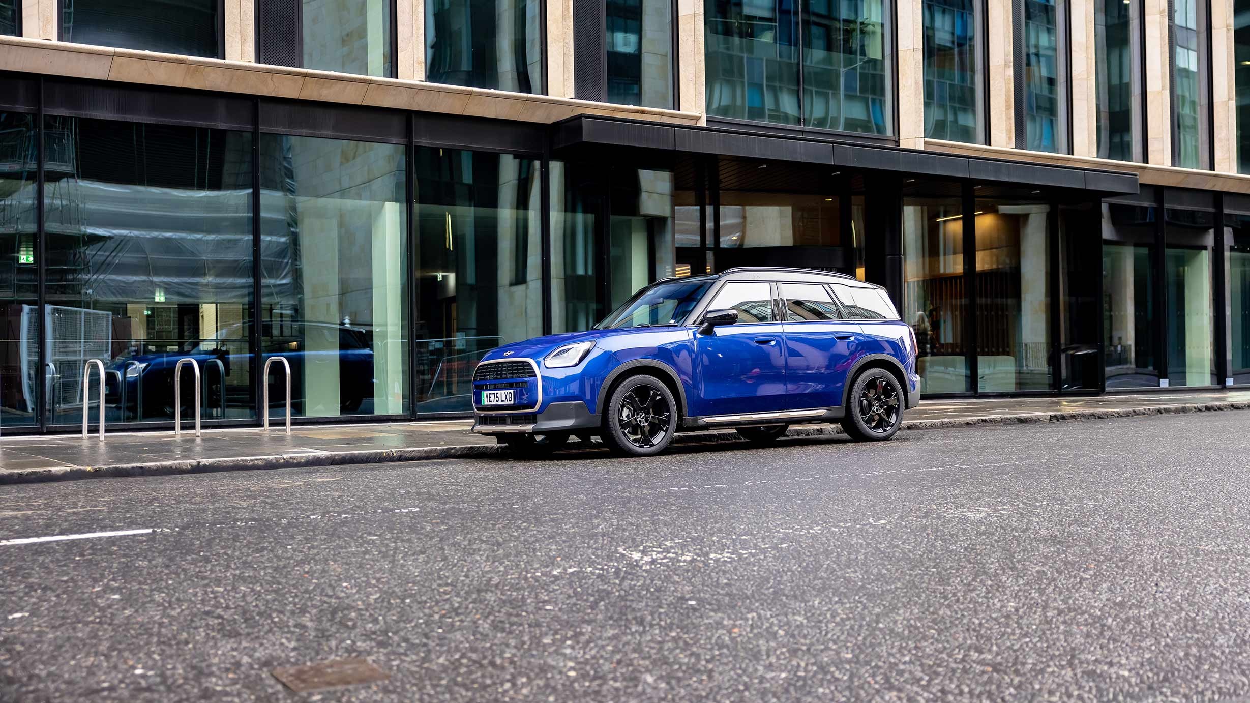 MINI Countryman parked off-road near hills
